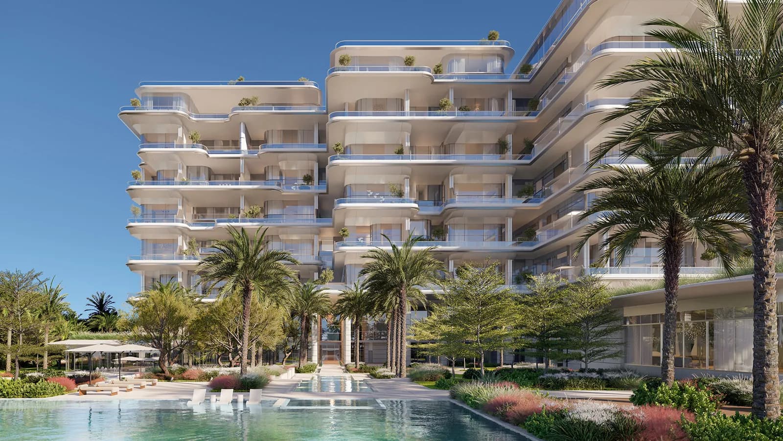 ORLA residences framed by palms above the resort pool